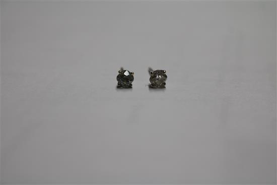 A pair of 18ct white gold and solitaire diamond ear studs, no butterflies.